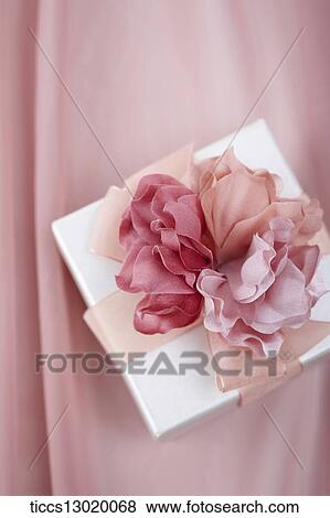 Stock Illustration - a gift with pink flower. Fotosearch