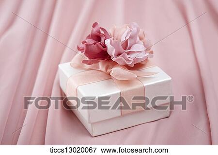 a gift with pink ribbons View Large Illustration Stock Illustration - a gift with pink ribbons. Fotosearch