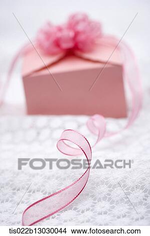 a pink present with a flower View Large Illustration Stock Illustration - a pink present with a flower. Fotosearch