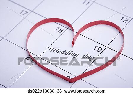 a red ribbon in a heart shape on a calendar View Large Illustration Drawing - a red ribbon in a heart shape on a calendar. Fotosearch