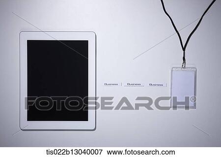 Stock Illustration - a tablet and a card holder. Fotosearch