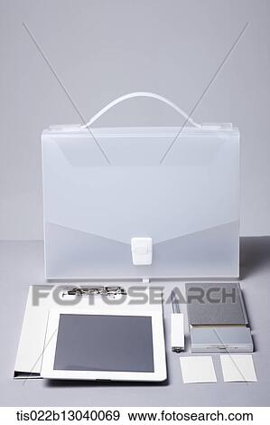 a tablet and a notebook outside a box View Large Illustration Stock Illustration - a tablet and a notebook outside a box. Fotosearch