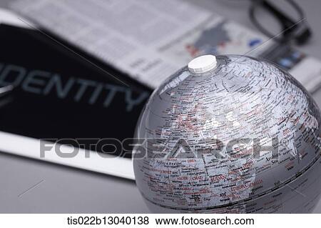 Stock Illustration - a tablet with the word identity an a globe. Fotosearch