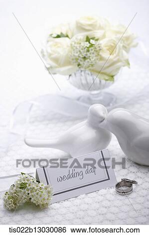 Stock Illustration - a wedding card with wedding rings. Fotosearch