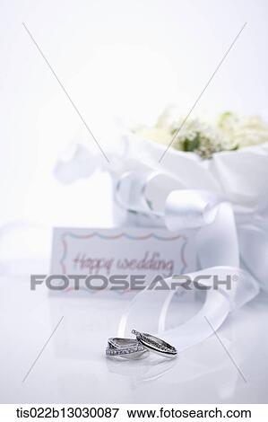 a wedding card with wedding rings View Large Illustration Stock Illustration - a wedding card with wedding rings. Fotosearch