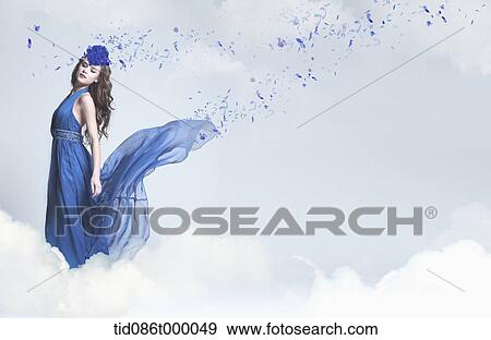 Stock Illustration - a woman dressed in blue standing on a cloud. Fotosearch