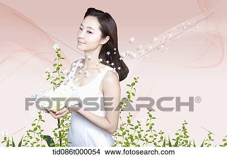 Stock Illustration - a woman holding flowers. Fotosearch