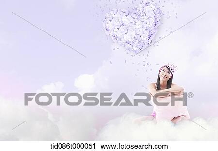 Clip Art - a woman sitting on a cloud. Fotosearch