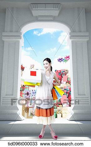 Drawing - a woman with shopping bags . Fotosearch