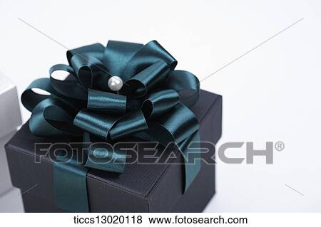 Stock Illustration - blue gift box with green ribbons. Fotosearch
