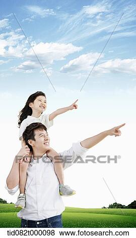 Stock Illustration - daughter sitting on father's neck pointing same direction. Fotosearch