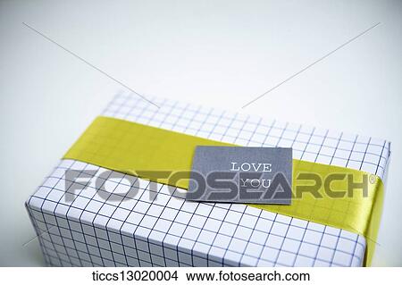 Stock Illustration - gift box in yellow colour. Fotosearch