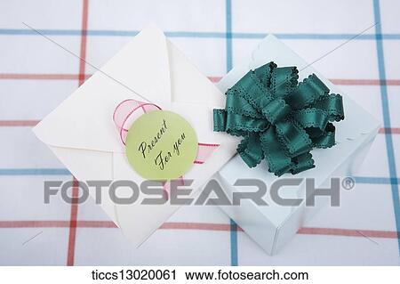 Clip Art - gift box with green ribbon and a card. Fotosearch
