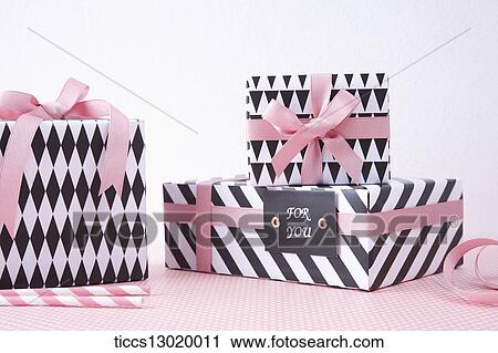 gift boxes in pink colour View Large Illustration Clip Art - gift boxes in pink colour. Fotosearch