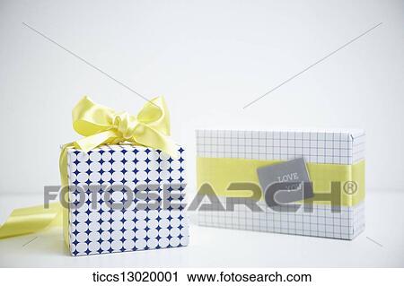 gift boxes in yellow colour View Large Illustration Clip Art - gift boxes in yellow colour. Fotosearch
