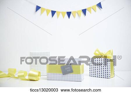 Drawing - gift boxes in yellow colour. Fotosearch
