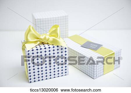 Stock Illustration - gift boxes in yellow colour. Fotosearch
