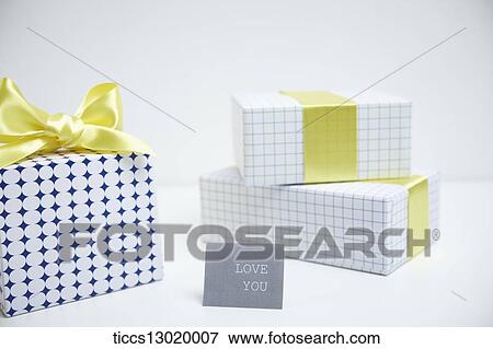 Stock Illustration - gift boxes in yellow colour. Fotosearch