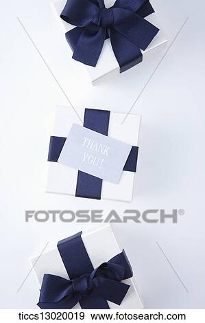 gift boxes with blue ribbons View Large Illustration Stock Illustration - gift boxes with blue ribbons . Fotosearch