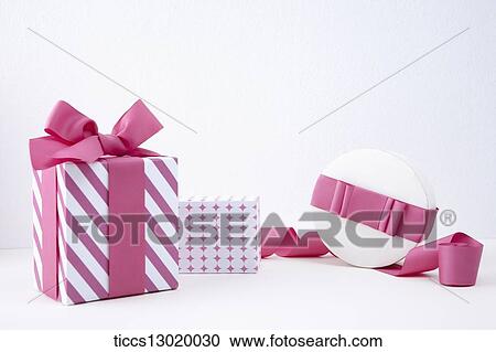Clipart - gift boxes with pink ribbons. Fotosearch