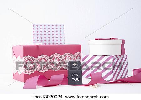 Stock Illustration - gift boxes with pink ribbons. Fotosearch