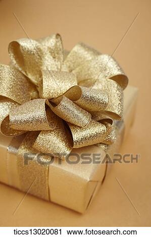 Clip Art - graceful orange gift box with golden ribbon. Fotosearch
