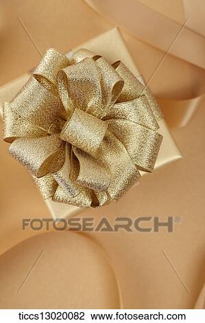 graceful orange gift box with golden ribbon View Large Illustration Drawing - graceful orange gift box with golden ribbon. Fotosearch