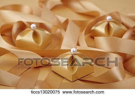 Stock Illustration - graceful orange gift boxes with pearls. Fotosearch