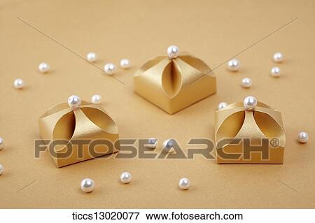 Stock Illustration - graceful orange gift boxes with pearls. Fotosearch