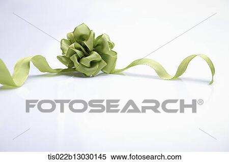 Stock Illustration - green ribbon with a flower. Fotosearch