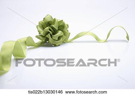 Stock Illustration - green ribbon with a flower. Fotosearch