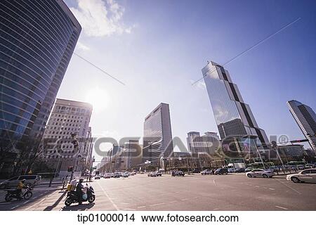 Stock Illustration - high buildings from a street view. Fotosearch