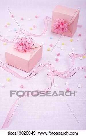 Stock Illustration - pink gift boxes with pink flowers. Fotosearch