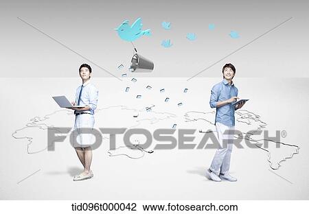 two men standing on the world map View Large Illustration Drawing - two men standing on the world map. Fotosearch
