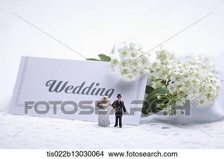 wedding card with two tiny wedding figures View Large Illustration Stock Illustration - wedding card with two tiny wedding figures. Fotosearch