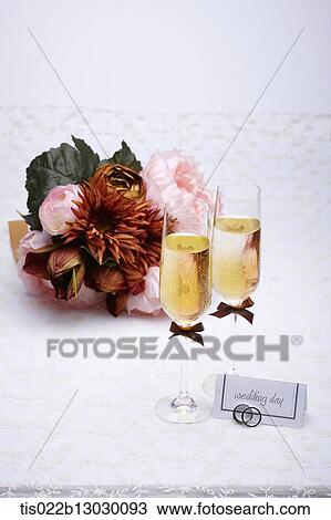 wedding rings with champagne and flowers View Large Illustration Drawing - wedding rings with champagne and flowers. Fotosearch