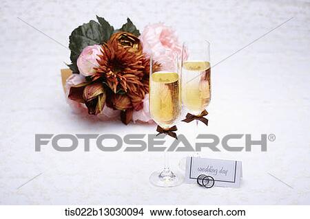 wedding rings with champagne and flowers View Large Illustration Stock Illustration - wedding rings with champagne and flowers. Fotosearch