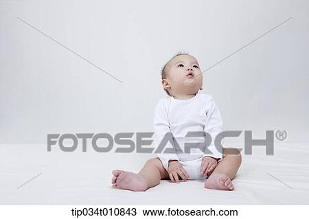 a baby and bubbles in the air View Large Photo Image Stock Image - a baby and bubbles in the air . Fotosearch