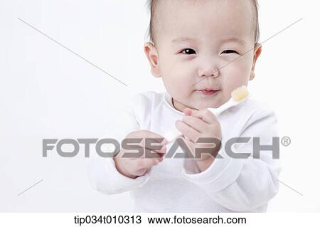 a baby brushing teeth View Large Photo Image Stock Image - a baby brushing teeth. Fotosearch
