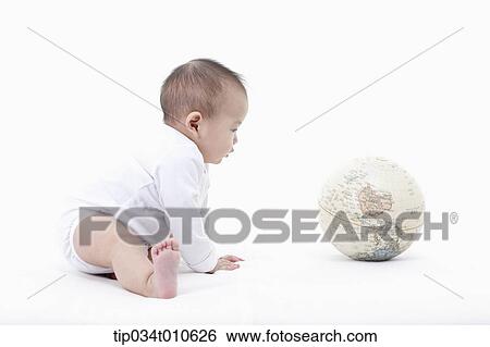 a baby playing with a globe View Large Photo Image Stock Photograph - a baby playing with a globe. Fotosearch