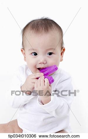 a baby playing with alphabet block View Large Photo Image Stock Photograph - a baby playing with alphabet block. Fotosearch