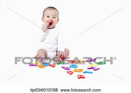 a baby playing with alphabet blocks View Large Photo Image Stock Photo - a baby playing with alphabet blocks. Fotosearch