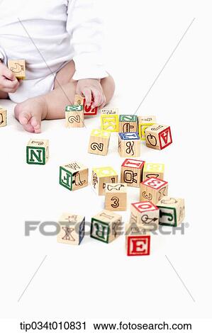 a baby playing with blocks View Large Photo Image Stock Image - a baby playing with blocks. Fotosearch