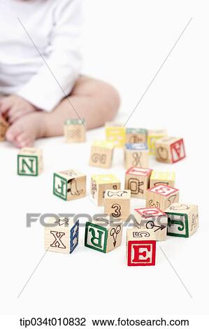 Stock Image - a baby playing with blocks. Fotosearch