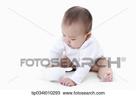 a baby with a bowl and a spoon View Large Photo Image Stock Image - a baby with a bowl and a spoon. Fotosearch
