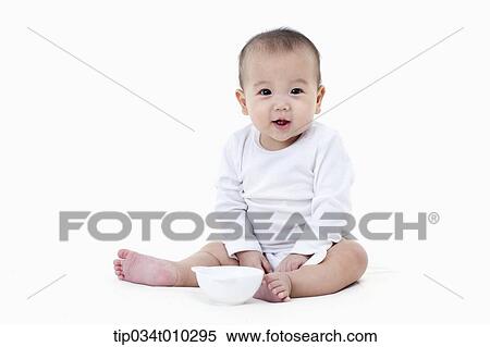 a baby with a bowl and a spoon View Large Photo Image Stock Photography - a baby with a bowl and a spoon. Fotosearch