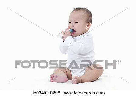 a baby with a spoon View Large Photo Image Stock Photo - a baby with a spoon. Fotosearch