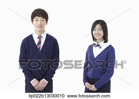a boy and a girl in school uniforms View Large Photo Image Stock Image - a boy and a girl in school uniforms. Fotosearch