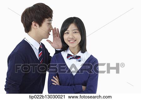 Stock Image - a boy and a girl in school uniforms. Fotosearch