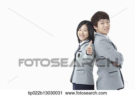 Stock Image - a boy and a girl in school uniforms. Fotosearch
